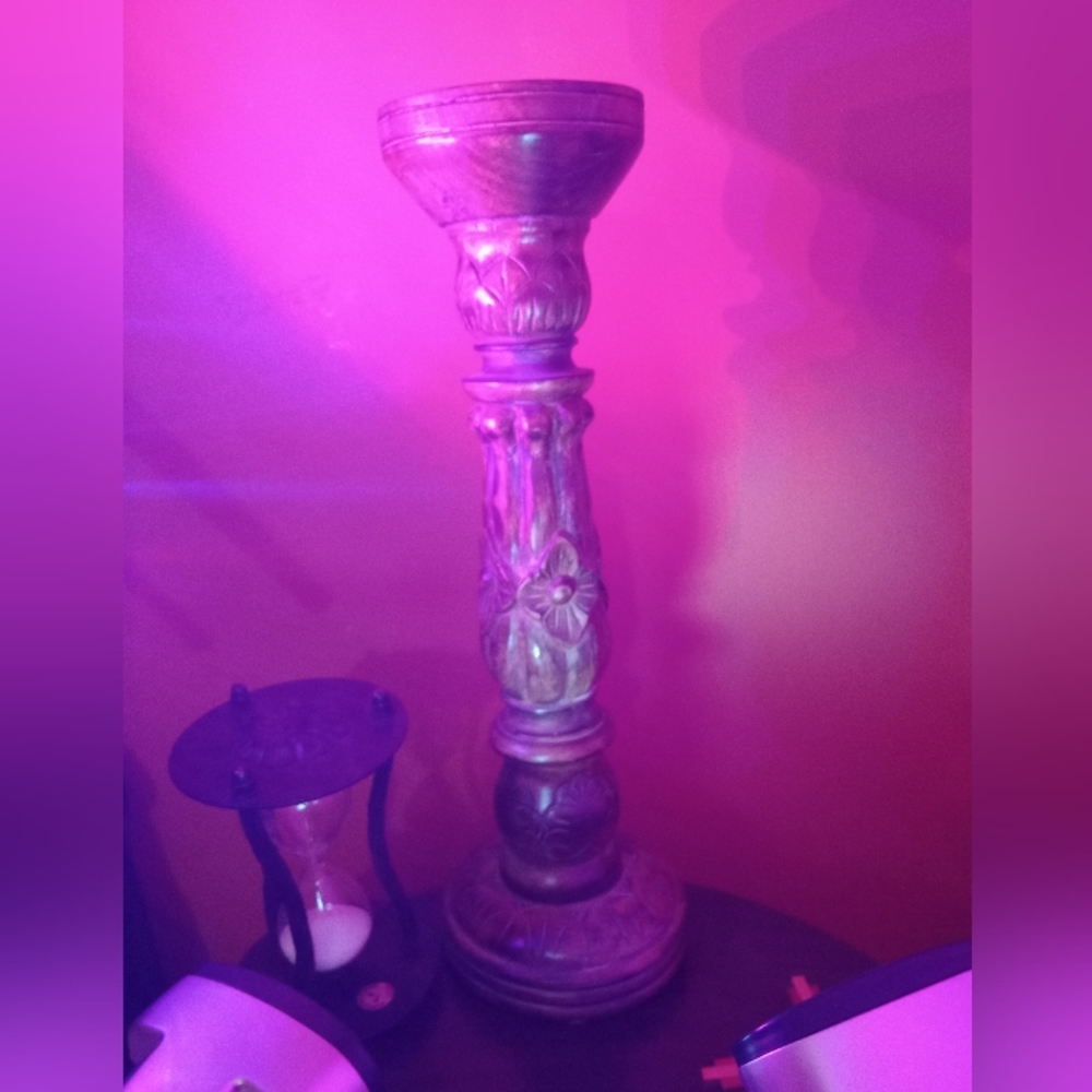 This is a marble wood antique candle holder